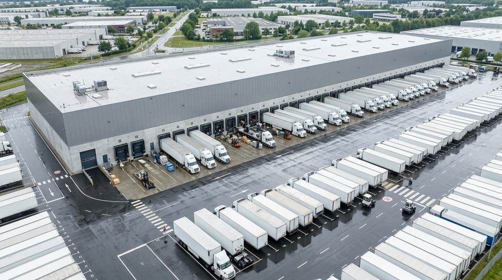 Trucks load and unload at opposite docks so freight flows straight through.